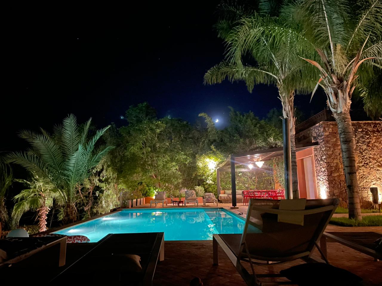 Villa Malika pool area at sunset